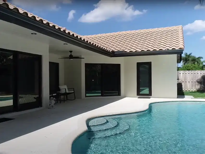 Impact sliding glass doors on South Florida home pool patio