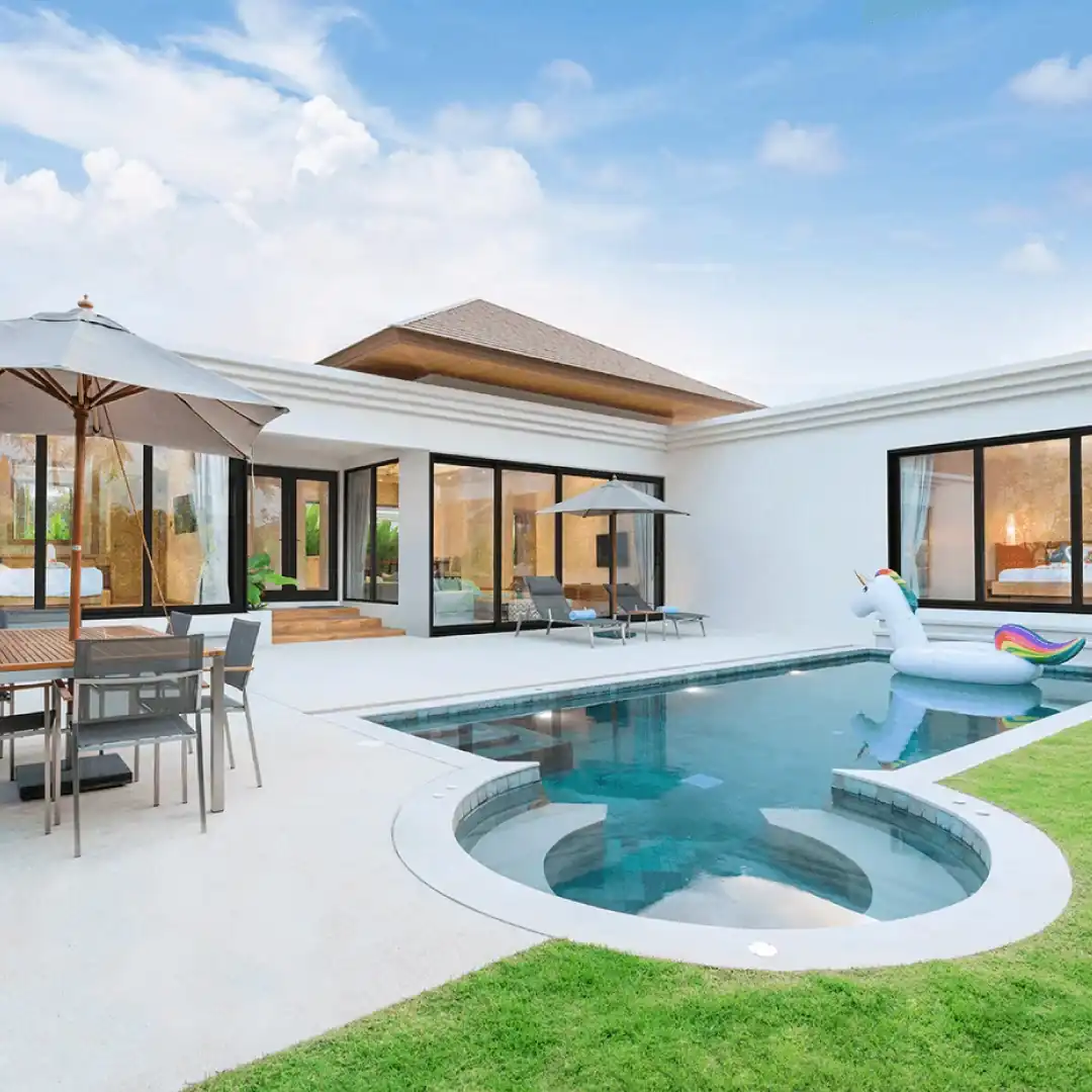Luxury home with black-framed impact sliding glass doors and pool