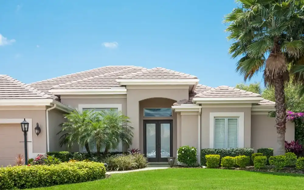 Broward County home with clay tile roof and impact entry doors