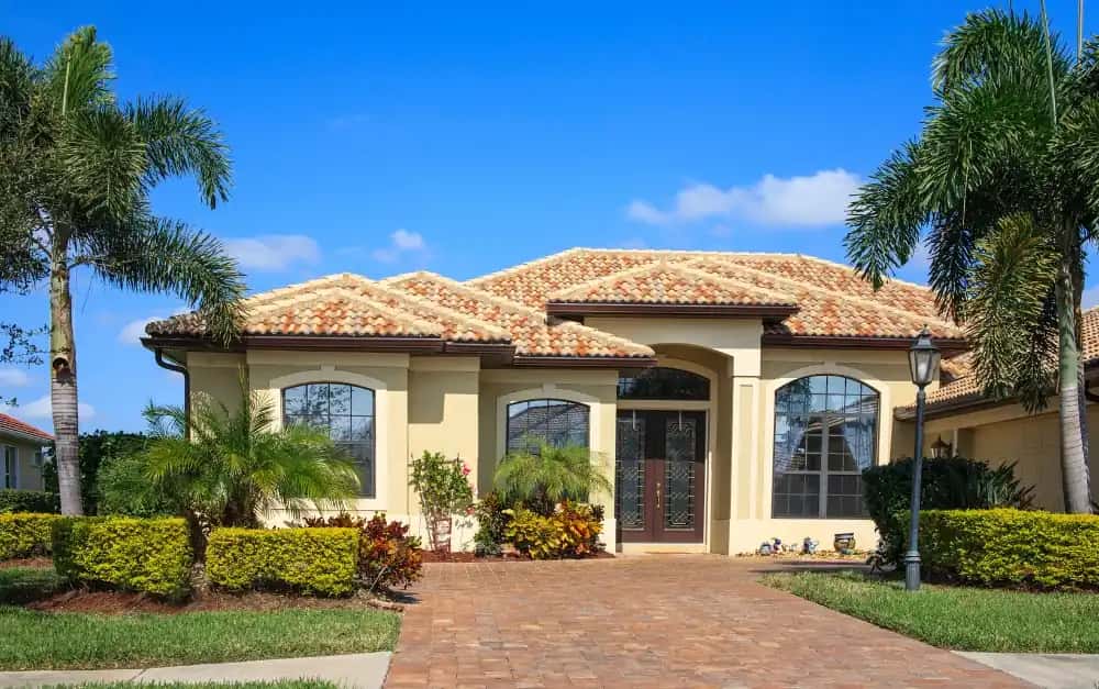 Broward County home with clay barrel tile roof and impact windows