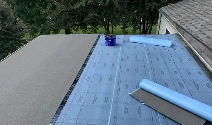 Flat roof underlayment installation with roofing cement and material rolls