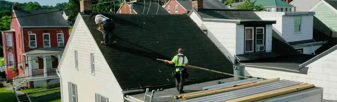 Roofing contractors installing new roof on residential home