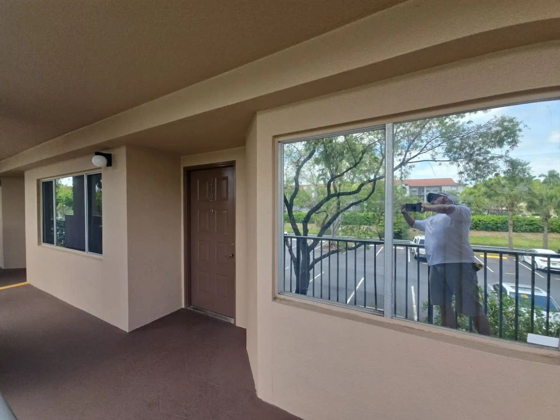 Impact windows installed on second-floor condo corridor Pembroke Pines Florida