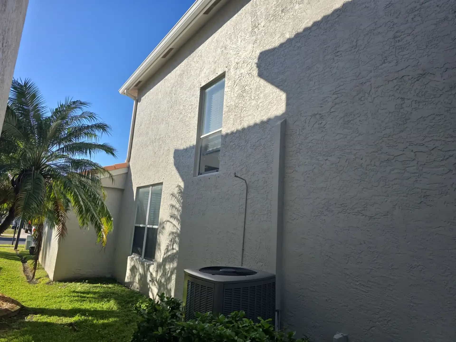 Impact windows installed on two-story stucco home in Miramar Florida