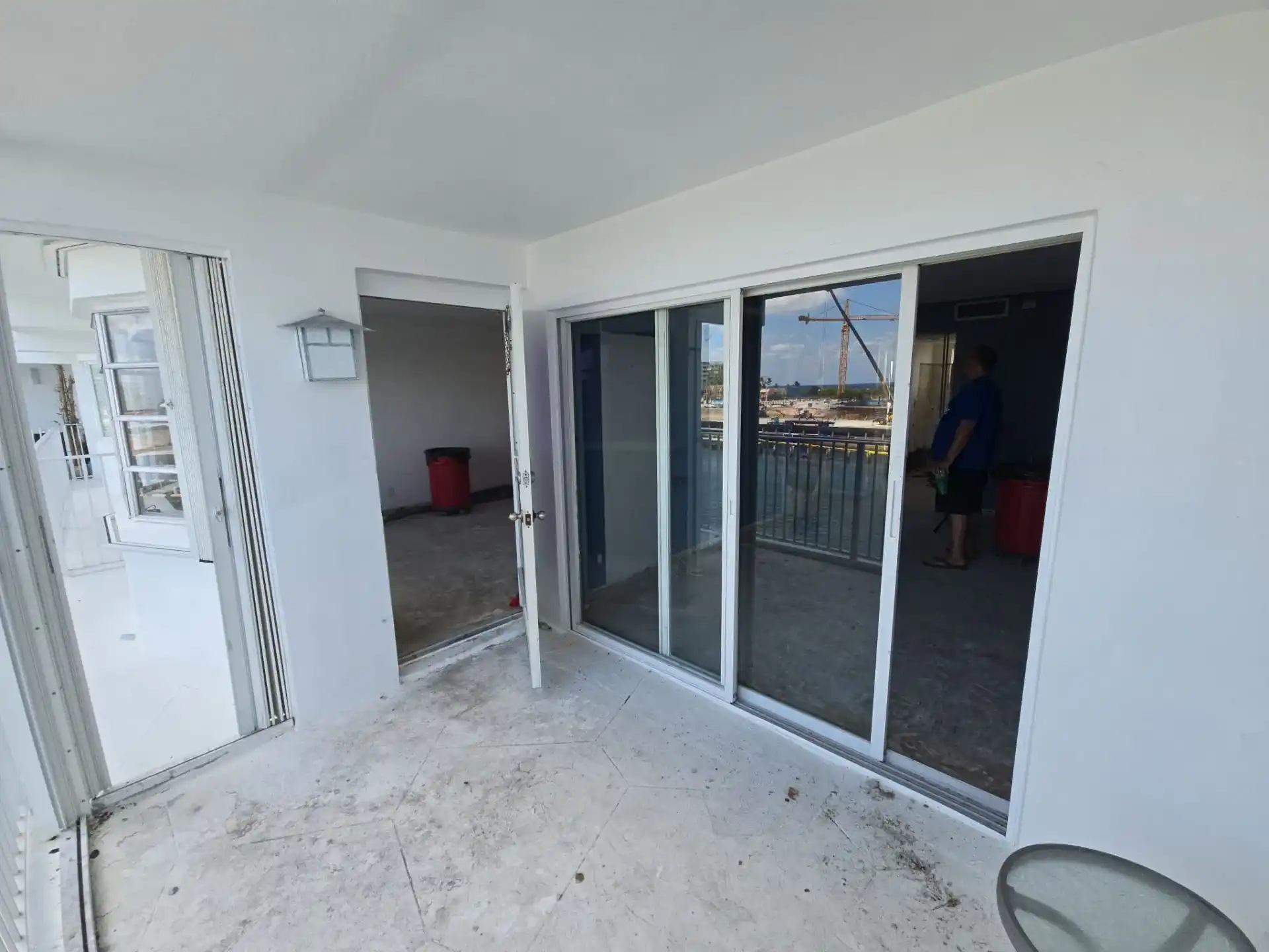 Impact sliding glass doors installed on a condo balcony