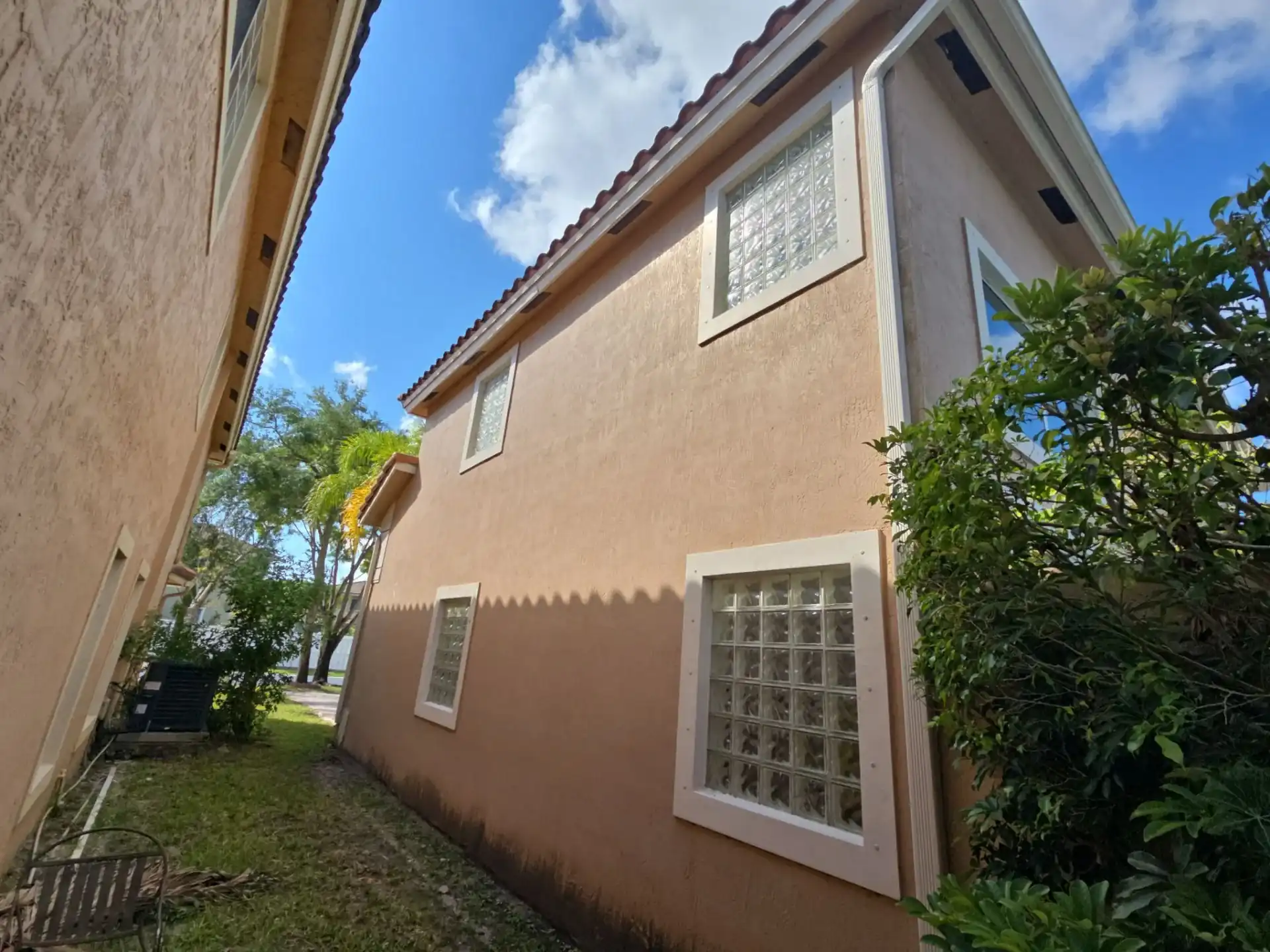 Glass block windows on two-story stucco home in Coral Springs Florida