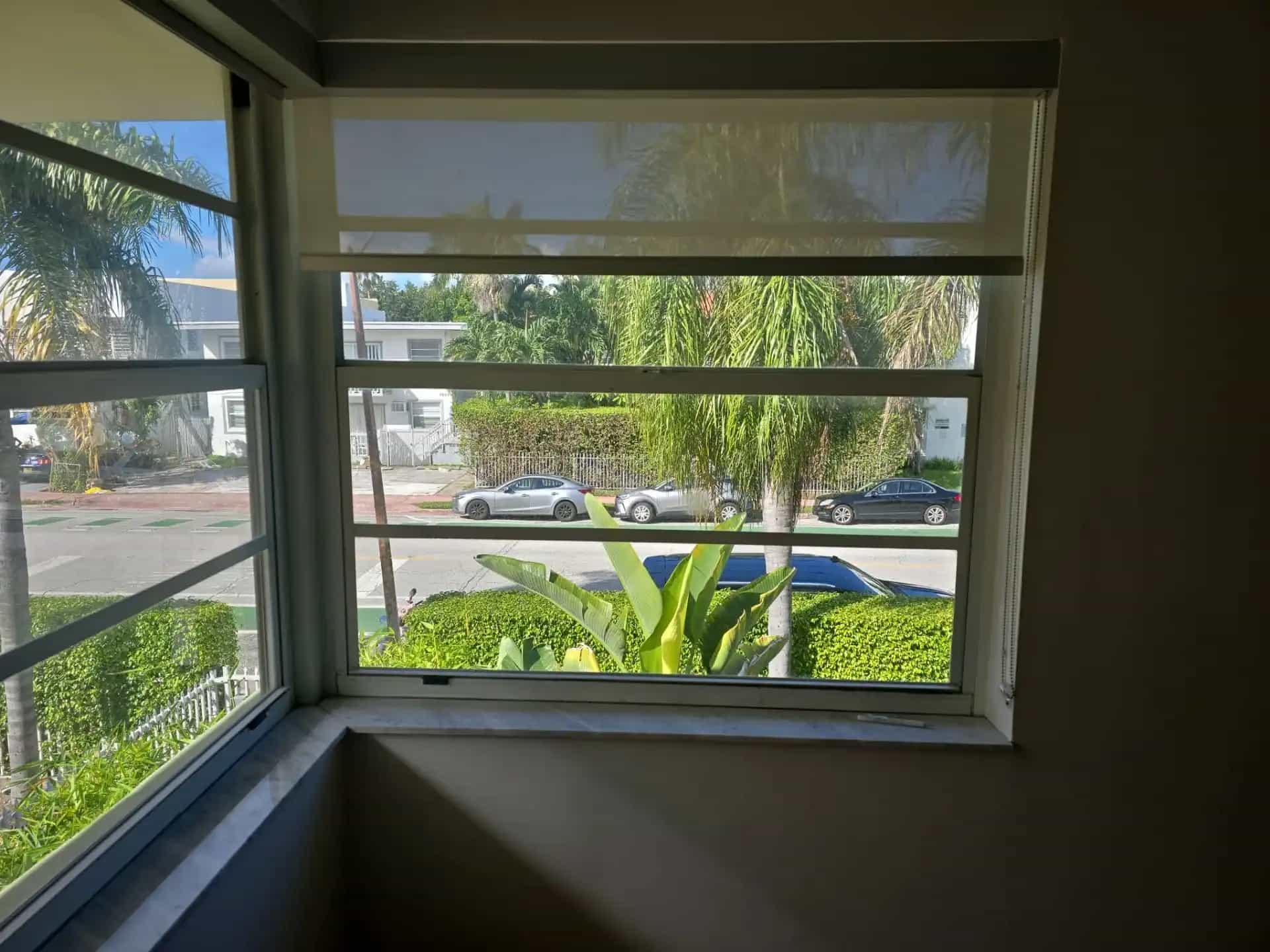 White frame impact windows with street view in Miami Beach home