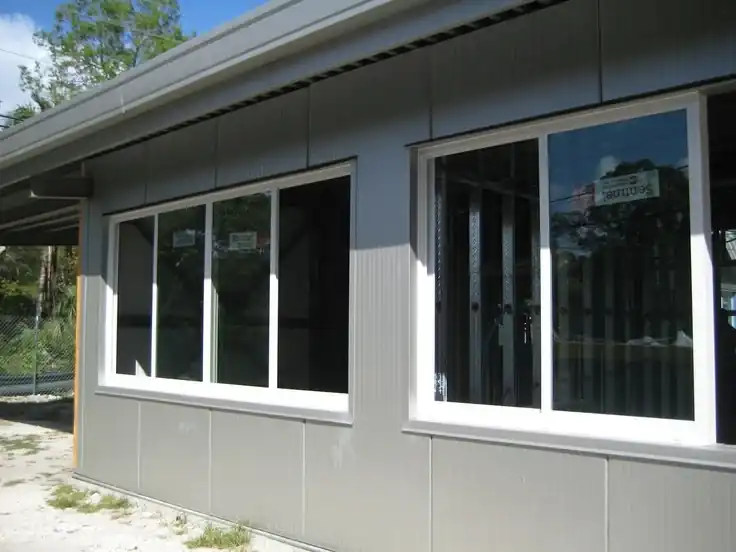 Impact sliding windows installed on South Florida commercial building exterior