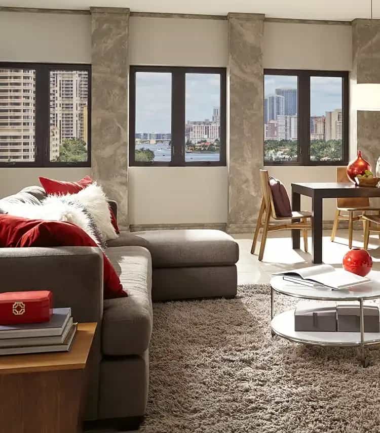 Dark-framed impact windows in modern Wilton Manors high-rise living room