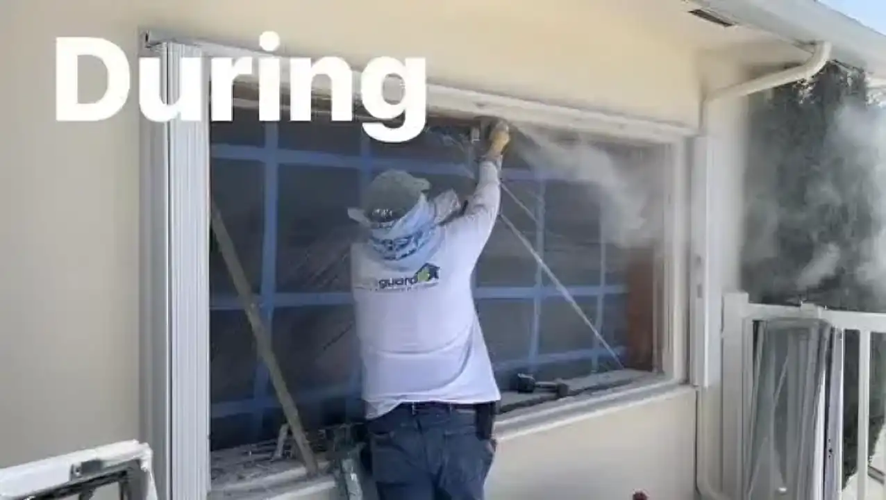 SafeGuard technician installing large impact window during replacement