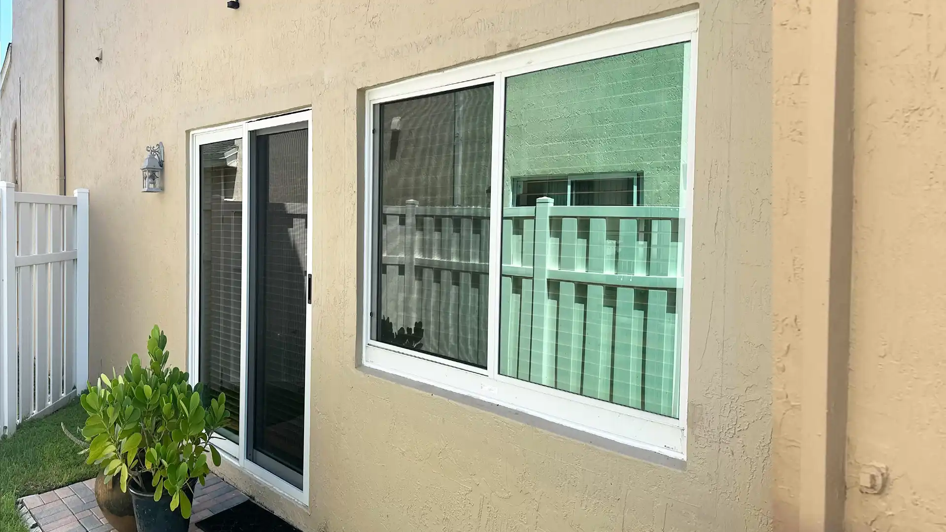 Impact sliding glass door and picture window installed on South Florida home