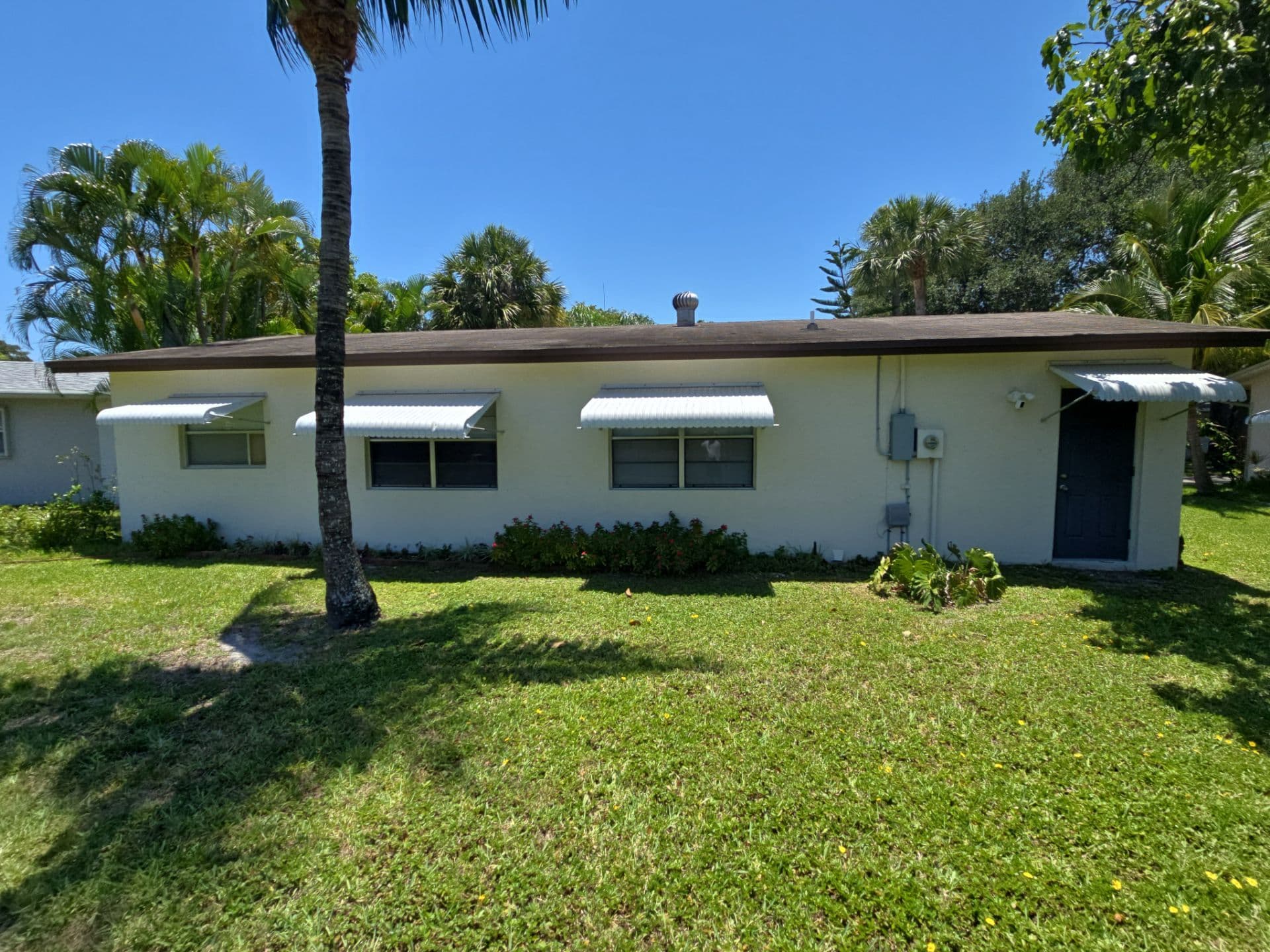 Crew setting a casement impact window in a Boynton Beach home — SafeGuard Impact Windows, Doors & Roofing, Boynton Beach, FL