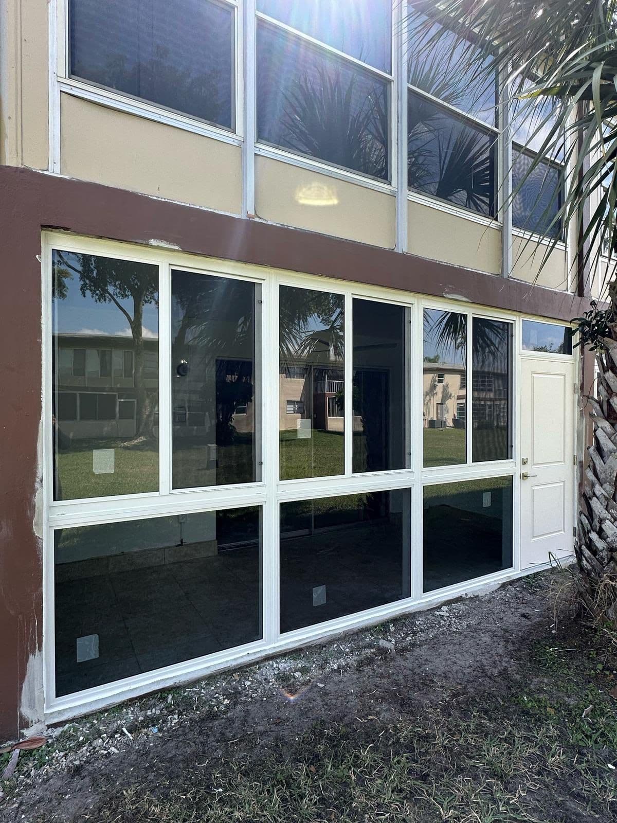 A finished install at a Coconut Creek lakeside home — SafeGuard Impact Windows, Doors & Roofing, Coconut Creek, FL
